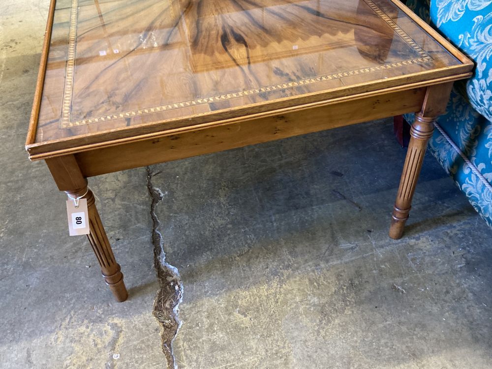 A reproduction rectangular inlaid yew coffee table, width 123cm, depth 78cm, height 52cm